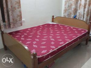 Brown Wooden cot And Red Mattress