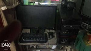 Black Flat Screen Computer Monitor; Keyboard; Mouse; Tower