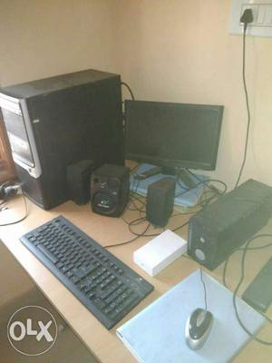 Black Flat Screen Computer Monitor; Keyboard; Mouse; Tower;