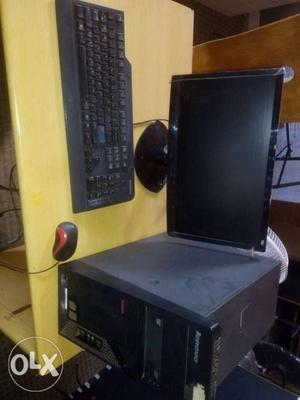 Black Flat Screen Computer Monitor, Keyboard, Tower, And