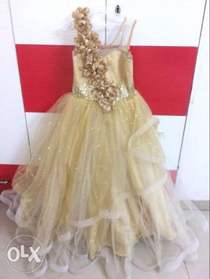 Golden color 8-9 years girl gown with matching