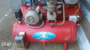 Red And Gray Air Compressor