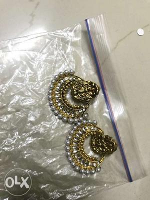 Artificial antique gold color ear rings.
