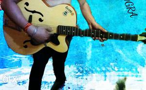 Brown And Black Acoustic Guitar