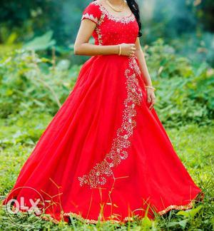 Designer Raw Silk Red Gown with Kundan works