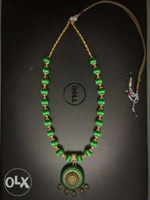 Handmade silk thread necklace with green and