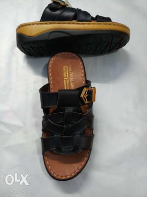 Pair Of Black-and-brown Leather Sandals