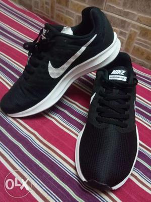 Pair Of Black-and-white Nike Running Shoes
