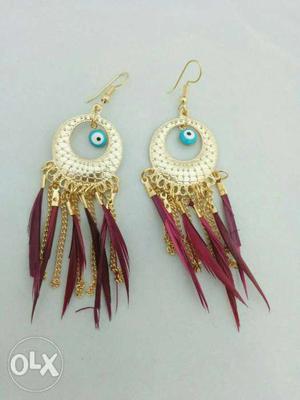 Pair Of Gold And Red Dangling Earrings