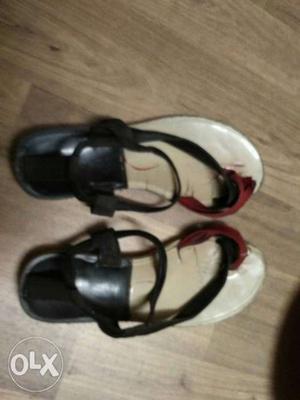 Pair Of White-and-black Toe Sandals