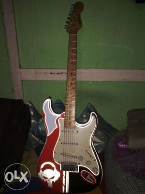 Red, Gray, And Black Electric Guitar