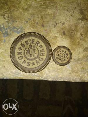Two Round Brown Metal Plates