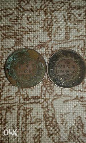 Two Round Copper-colored Indian Coins