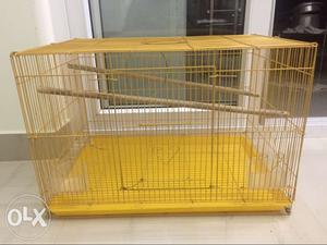 Bird cage with plastic tray and cups