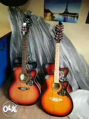 Brown, Black, Blue, And Red Acoustic Guitars