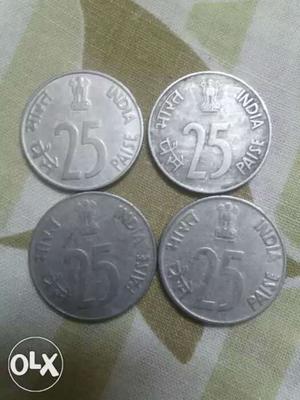 Four Round Silver-colored 25 Indian Paise Coins