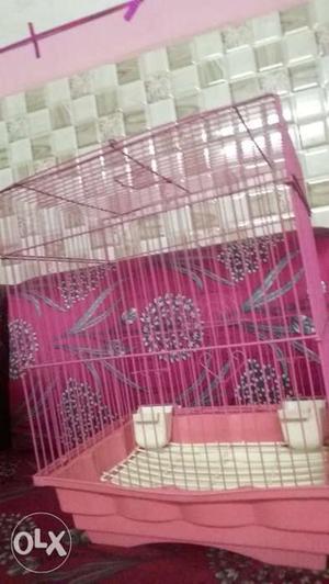 This is a beautiful pink cage which is used for