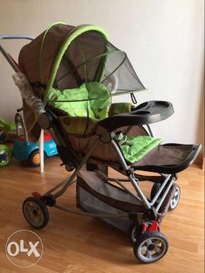 Baby's Green And Brown Sit And Stand Stroller