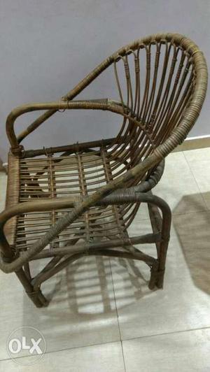Brown Wooden Rocking Chair With Brown Wicker Chair