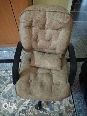 Computer chair with wheels. One arm rest is a