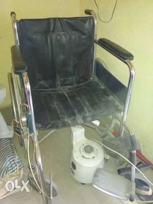 Gray Stainless Steel And Black Leather Wheelchair