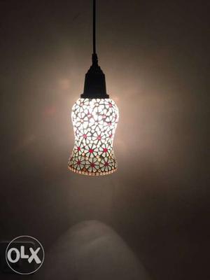 Product 1 It’s a tiffiny Hanging light having 4