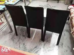 Three Black Leather Chairs