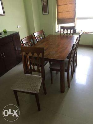 6 Seater Dining Table with Cushioned Chairs.