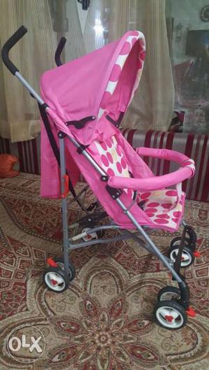 Baby's Pink And Gray Umbrella Stroller