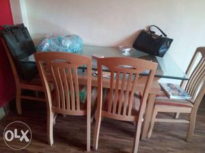 Brown Wooden Table With Four Chairs