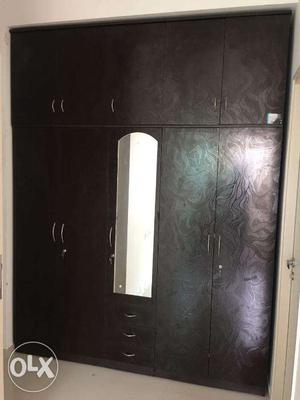 Very smart and black Five door wardrobe.