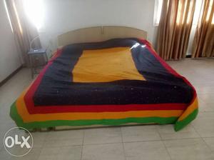Wooden double bed in excellent condition.