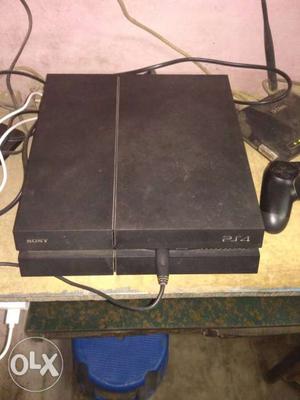Black Sony PS4 Game Console With Controller