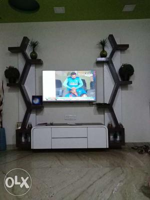 Flat Screen TV And Black And White Wooden Entertainment