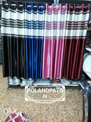 Four Black, Blue, Pink, And Maroon Curtains