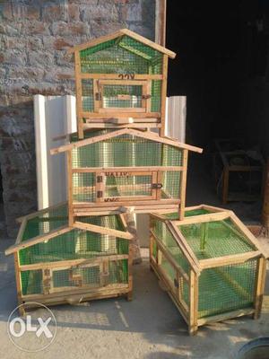 Four Brown Wooden Framed Pet Coops