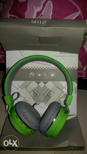 Green And Gray Headphones With Box