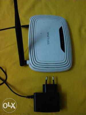 Tp-Link wifi router along with charger and LAN