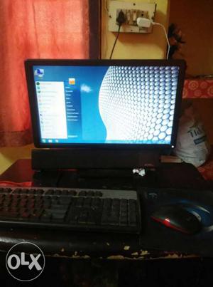 Black Computer Monitor, Mouse, And Keyboard