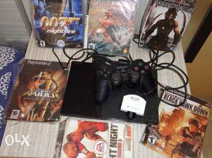 Black Sony PS2 Console With Controller And Game Cases Lot