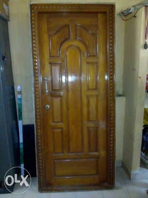 Brown Wooden Paneled Door
