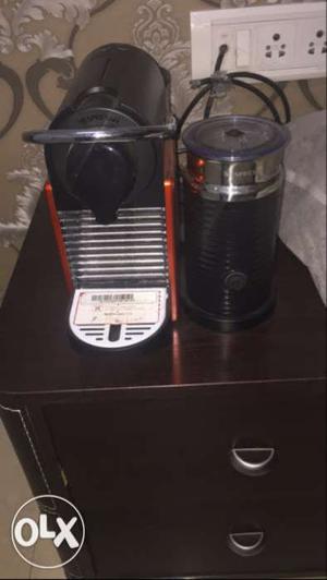 Nespresso coffee machine with milk frosting