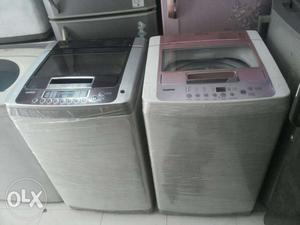 White And Black Clothes Washer And Dryer Set