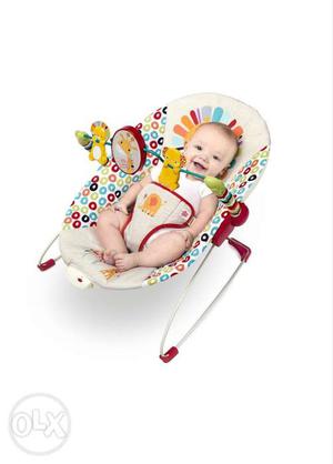 Baby's Beige And Red Bouncer