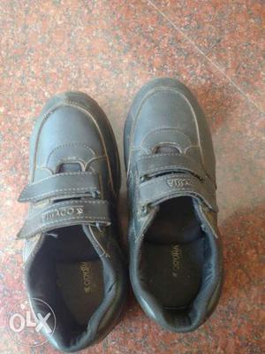 Pair Of Gray Leather Velcro Shoes