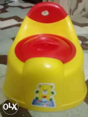 Toddler's Yellow And Red Potty Trainer