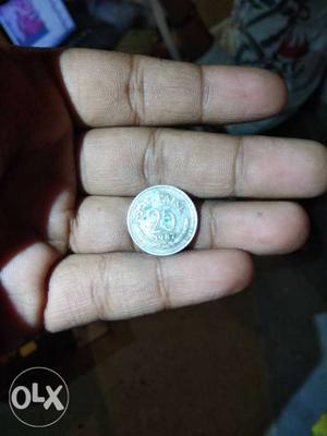 25 Round Silver-colored Indian Coin