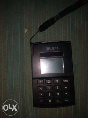 Black And Gray MSwipe Card Terminal its runing Sim card and