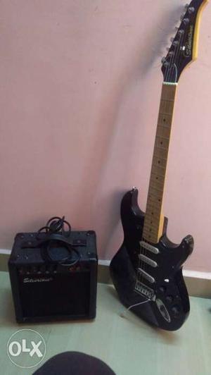 Black electric Guitar With Amplifier