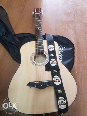Brown Acoustic Guitar With very good condition 1 month old